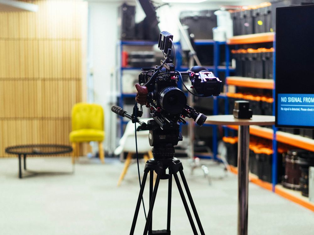 Cinema camera on a tripod in a production studio